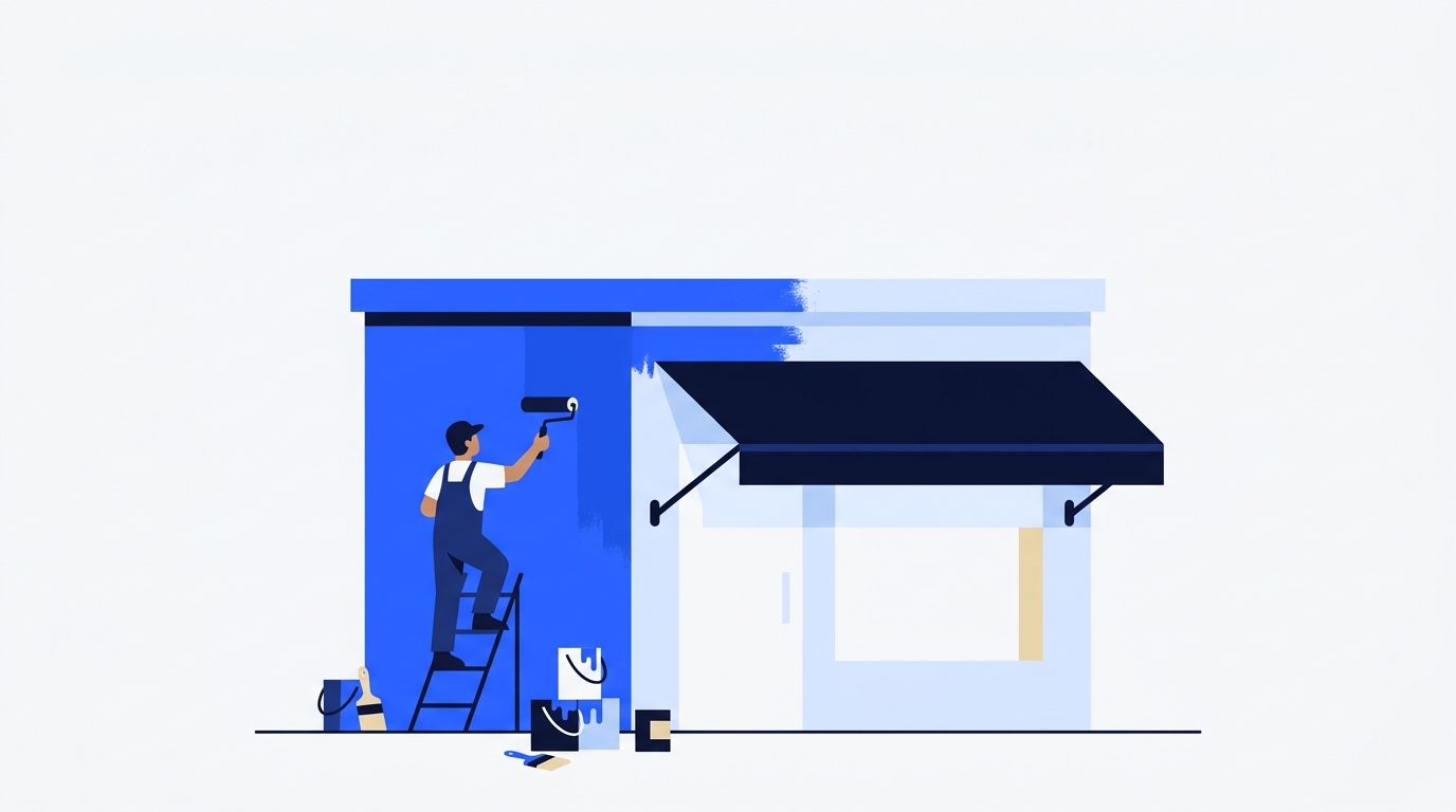A painter on a ladder rolls fresh blue paint onto a small storefront, half finished