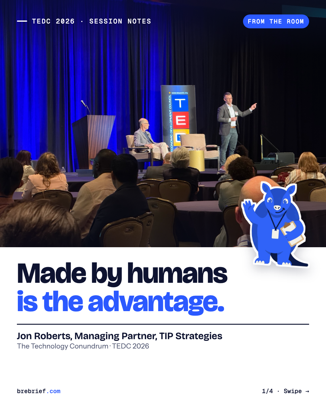 Jon Roberts and a TIP Strategies colleague on stage at TEDC 2026, with Arlo the armadillo sticker.